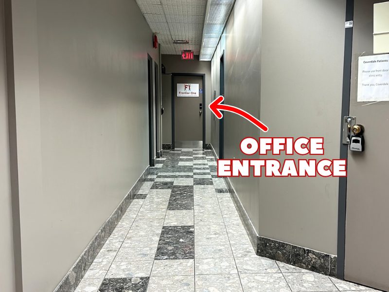 London office: the hallway, with an arrow to the office entrance