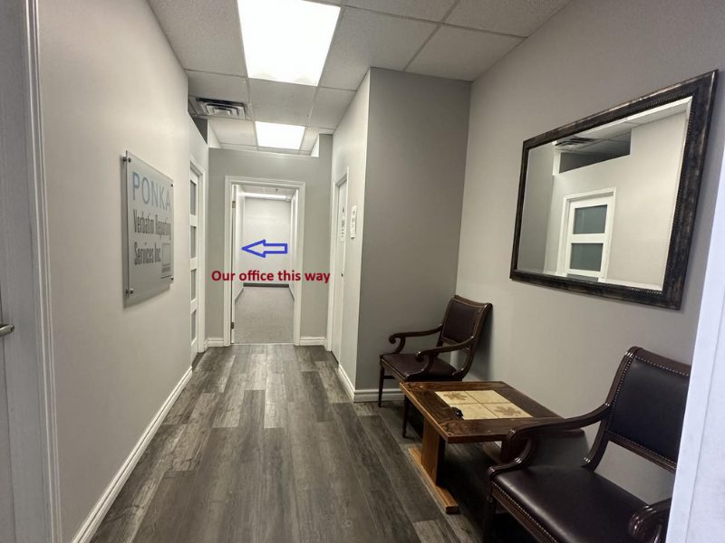 Oakville office: the waiting room, with a sign pointing to the office